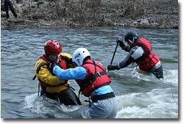 practicing swiftwater rescue techniques